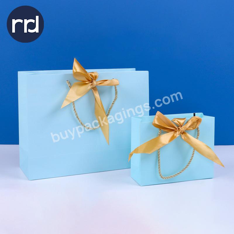 RR Donnelley Eco Friendly Customized Luxurious Retail Foldable Cloth Gift Blue Coated Paper Shopping Bags with Ribbon Handles