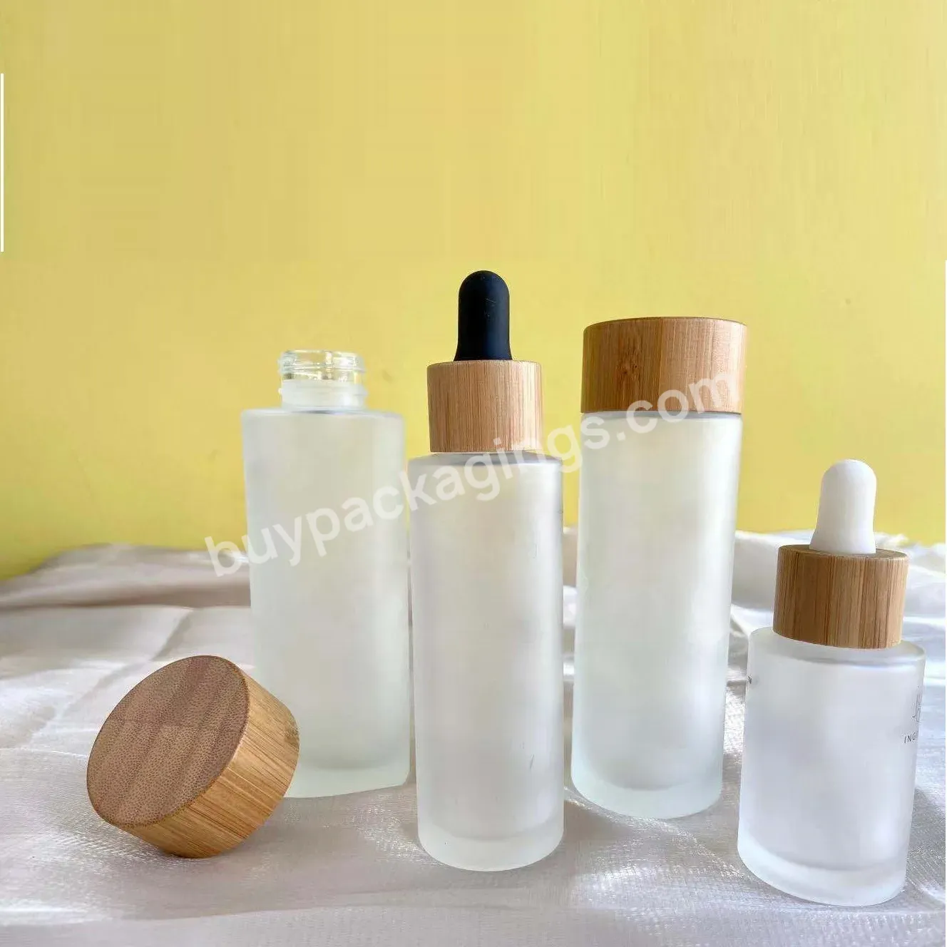 100ml Glass Bottle With Bamboo Screw Cap For Lotion Essential Oil Toner Eco-friendly Cosmetic Bottles - Buy Glass Lotion Bottle With Bamboo Lid,Bamboo Bottles,Eco-friendly Bottles.