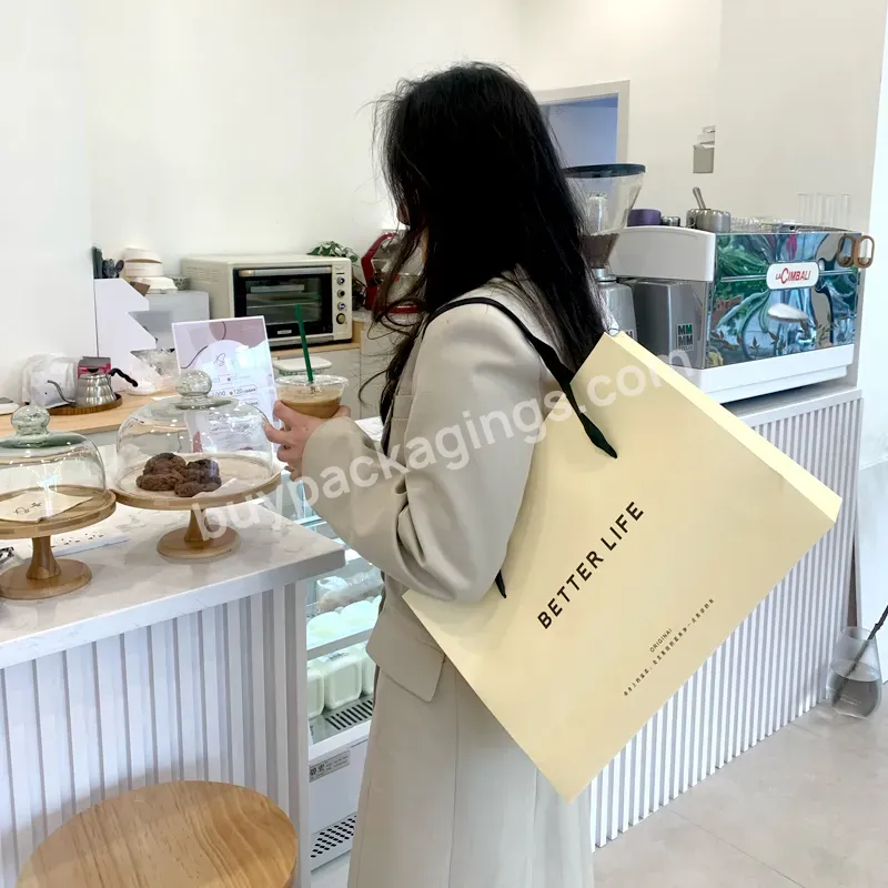 Branded Packaging Bags With Printed Logos For Shopping Cream Garment Paper Bags Beige Paper Bag For Cloth Packaging - Buy Beige Paper Bag,Cream Paper Shopping Bag,Custom Printed Paper Garment Paper Bag.