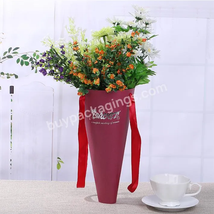 Cone shape cardboard flower box with carry ribbon handle