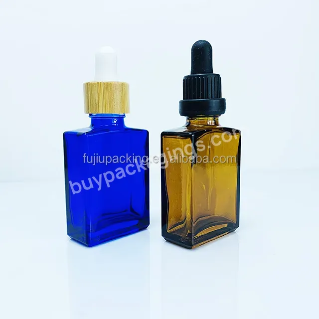 Empty Blue Flat Square Rectangle 15ml 30ml Cosmetic Skincare Packaging Amber Glass Dropper Oil Serum Bottle With Bamboo Cap - Buy Serum Bottle With Bamboo Cap,Hot Selling 12ml 30ml Clear Rectangular Flat Square Glass Bottle With Bamboo,Customized Cos