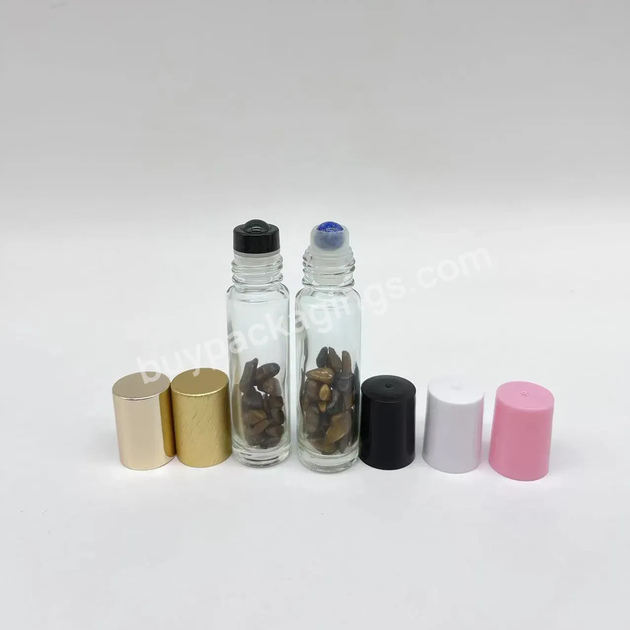 Empty Clear Glass Gemstone Roller Oil Perfume Bottle With Crystal Chips Inside 10ml - Buy Gemstone Face Massage Roller Oil Perfume Bottle,10ml Clear Glass Roller Bottle With Gemstone Chips,Clear Blue Crystal Perfume Bottle.