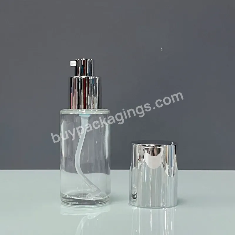 Glass Bottle 50ml Luxury Cosmetic Serum Factory Recyclable Round 50ml Clear Glass Bottle With Silver Pump Cap