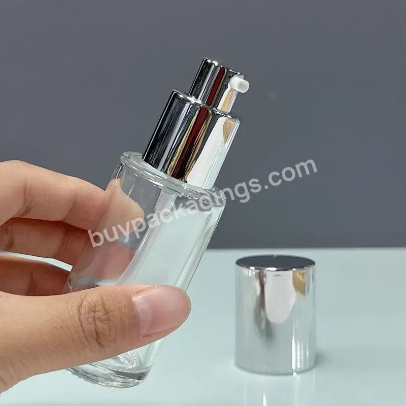 Glass Bottle 50ml Luxury Cosmetic Serum Factory Recyclable Round 50ml Clear Glass Bottle With Silver Pump Cap