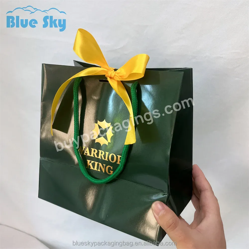 Made In China Mass Production Europe And The United States Hot Bright Film Bow Color Paper Shopping Bag Gift Bag Paper Bag - Buy Paper Packaging Bags,Clothing Shopping Bags,Custom Logo Packaging Bags.
