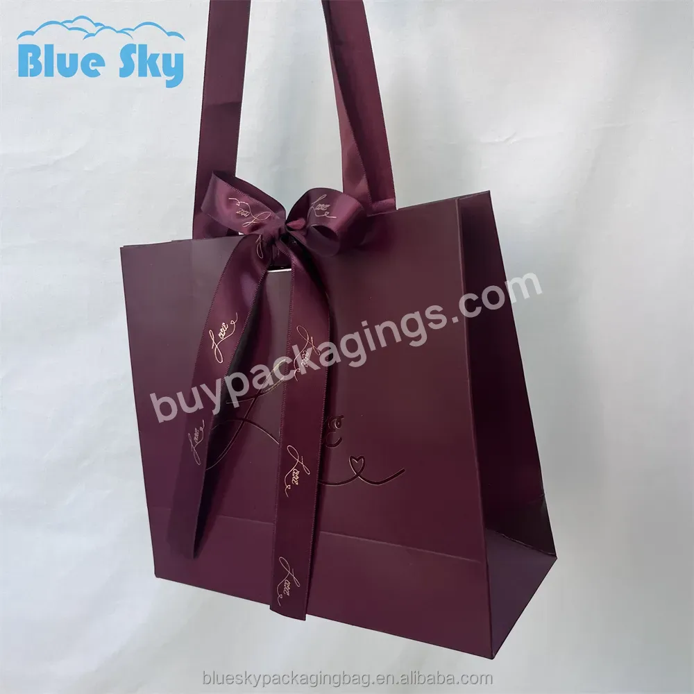 Repeated Use Of Wholesale Custom Printed Bow Paper Bags Printed With Ribbon Handles For Shopping Bags Gift Bags - Buy Paper Packaging Bags,Clothing Shopping Bags,Custom Logo Packaging Bags.