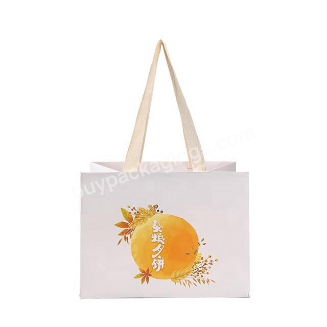 RR Donnelley Wholesale Custom logo printing white shopping giift paper bag with black cotton handle