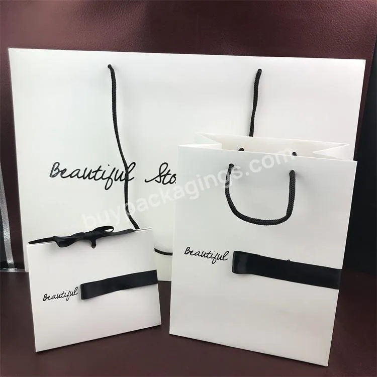 Wholesale Custom Printed Black And White Luxury Shopping Carry Gift Paper Bag With Handle Ribbon For Promotion