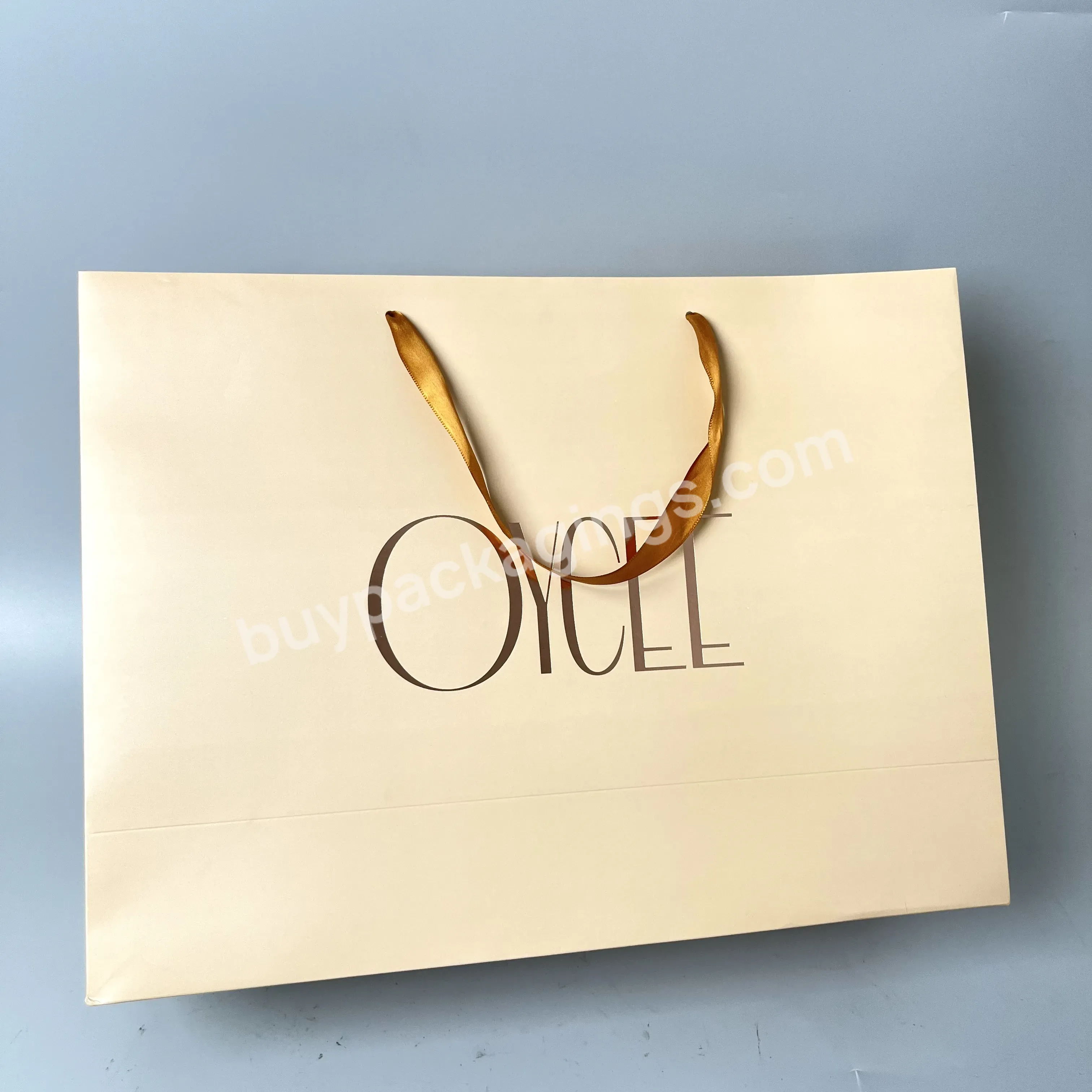 100% Recyclable Custom Popular Cream Color Cardboard Bag Printing Rose Gold Foil Logo Shopping Bag