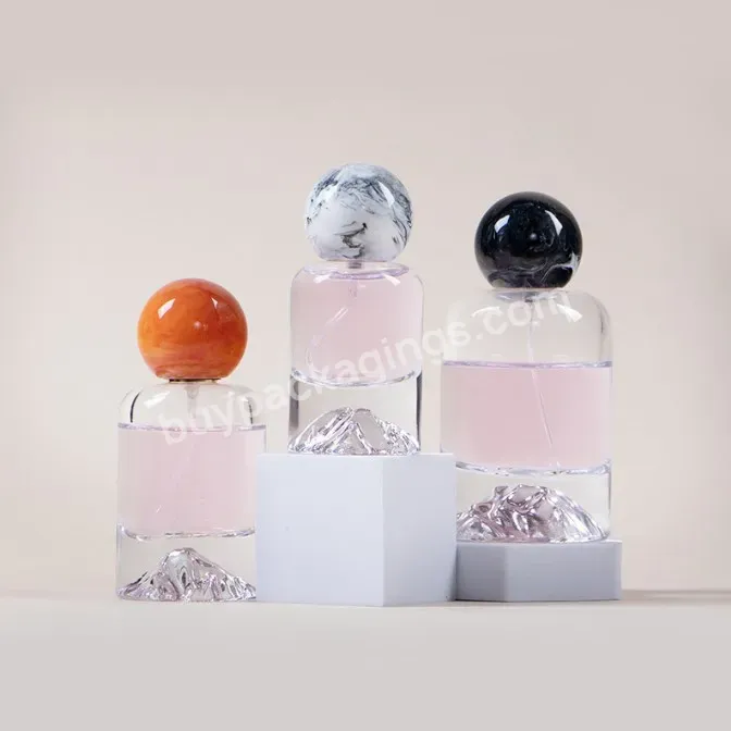 30ml 50ml 100ml Luxury Clear Cylindrical Special Bottom Mountain Bottom Glass Perfume Bottle With Ball Resin Cap