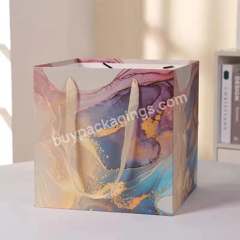 China Competitive Price Elegant Customized Brand Logo Luxury Boutique Shopping White Paper Gift Bags With Rope Handles