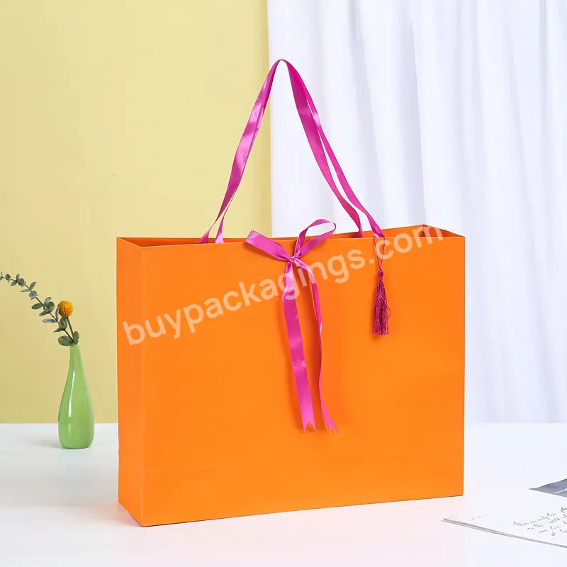 China Manufacturer Custom Wholesale Tote Carry Personalized Biodegradable Luxury Clothing Pink Cardboard Paper Packaging Bag