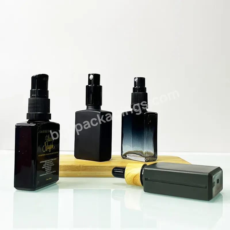 China Manufacturer Empty 30ml 50ml 100ml Matte Black Essential Oil Round Glass Dropper Bottle With Dropper Lids