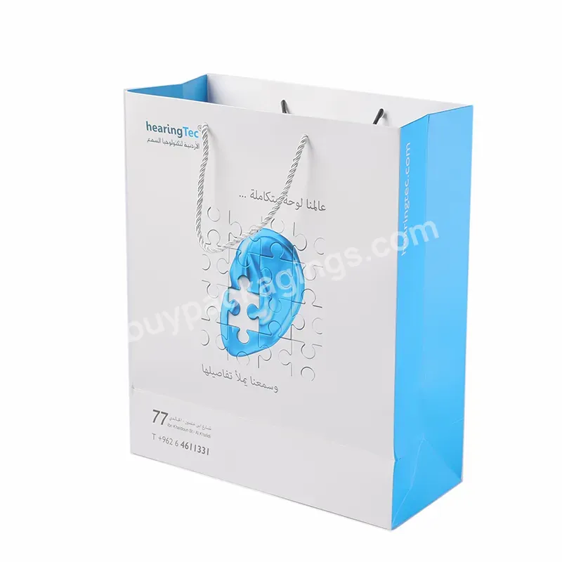 China Manufacturers Custom Printing Cheap Shopping Carry Packaging Hot Sell Art Paper Shopping Paper Bags For Cloth Cosmetics