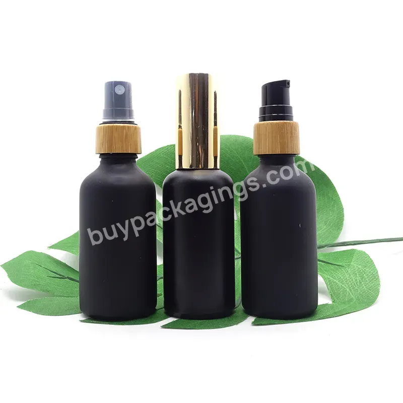 China Wholesale Refillable 10ml 30ml 50ml 100ml Matte Black Round Glass Dropper Bottle With Dropper Lids