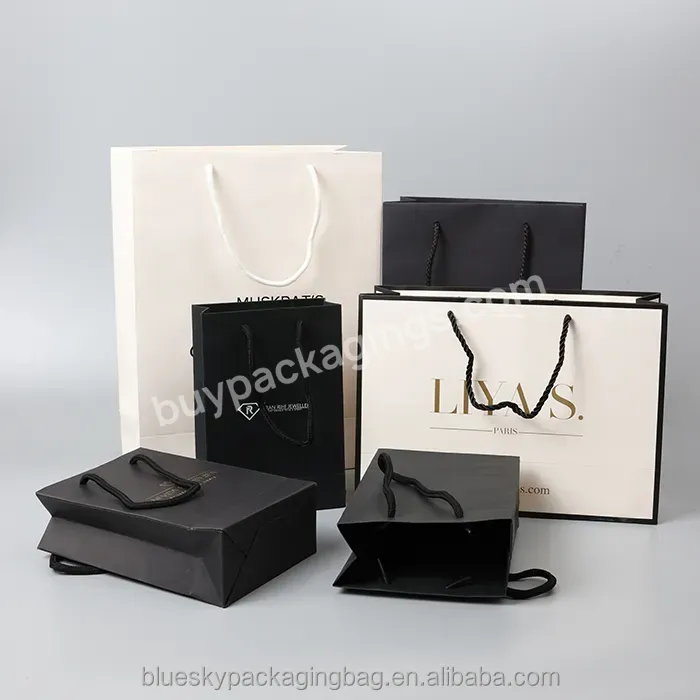 Custom 230g Cardboard Paper Bag Kraft Paper Packaging Bag Shopping Paper Bag With Ribbon For Clothing
