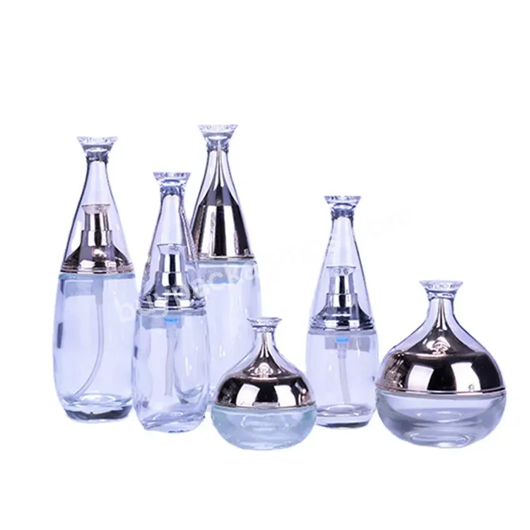 Custom Elegant Cosmetic Glass Bottles With Printing Logo Wholesale Luxury Clear Round Bottles For Skin Care Serum