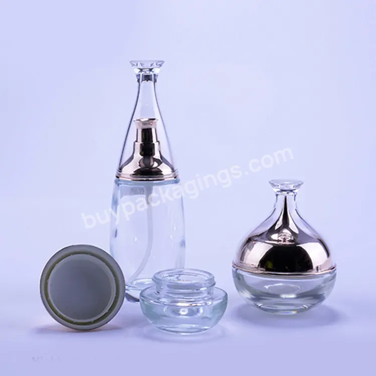 Custom Elegant Cosmetic Glass Bottles With Printing Logo Wholesale Luxury Clear Round Bottles For Skin Care Serum