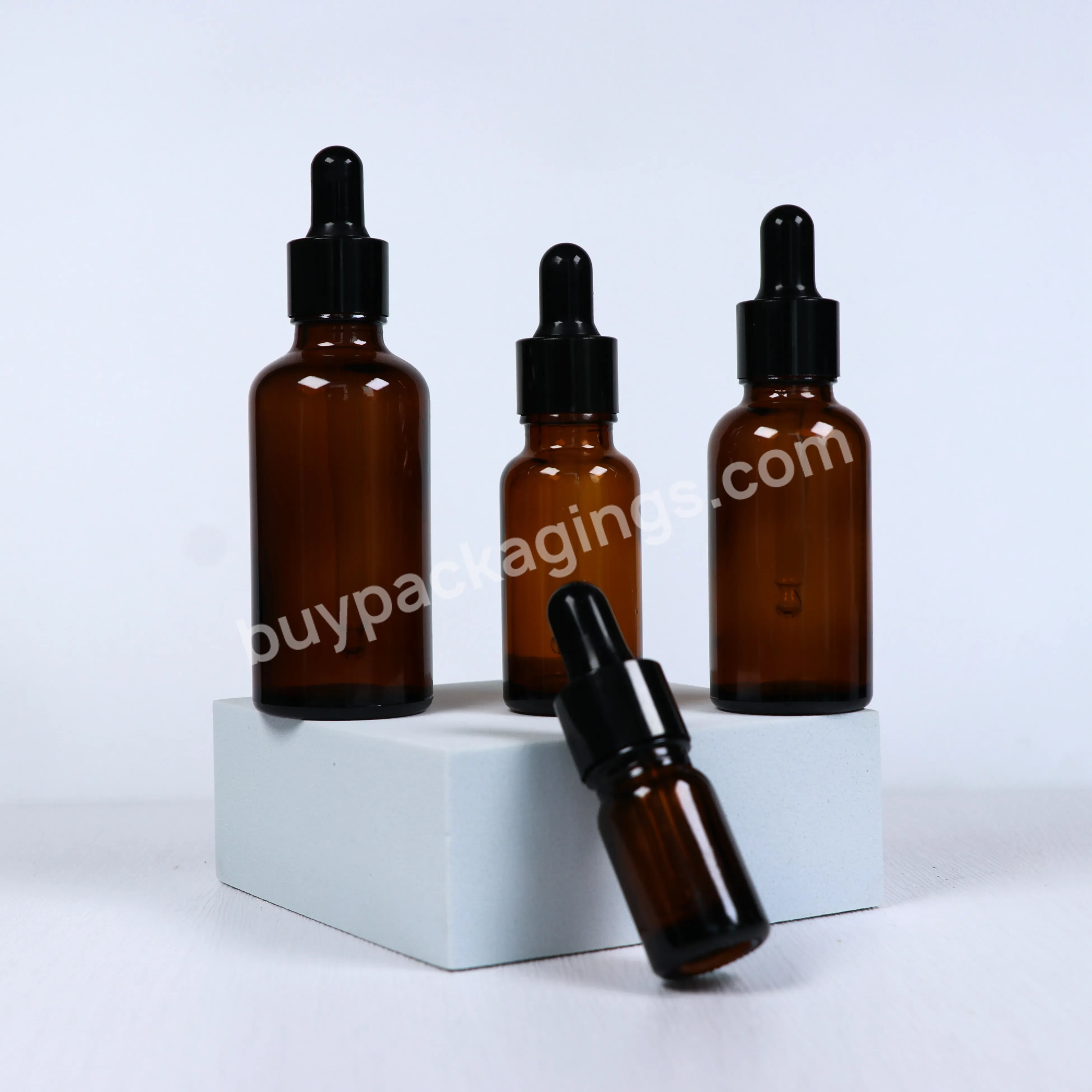 Custom Logo Glass Cosmetic Serum Bottle 30ml 50ml 100ml Brown Round Shoulder Dropper Bottle For Essential Oils