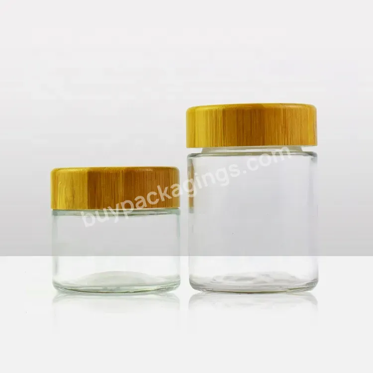 Custom Logo Printed 2oz 4oz Child Resistant Glass Jar With Bamboo Lid Bamboo Container Clear Bottle For Raw Flower Package