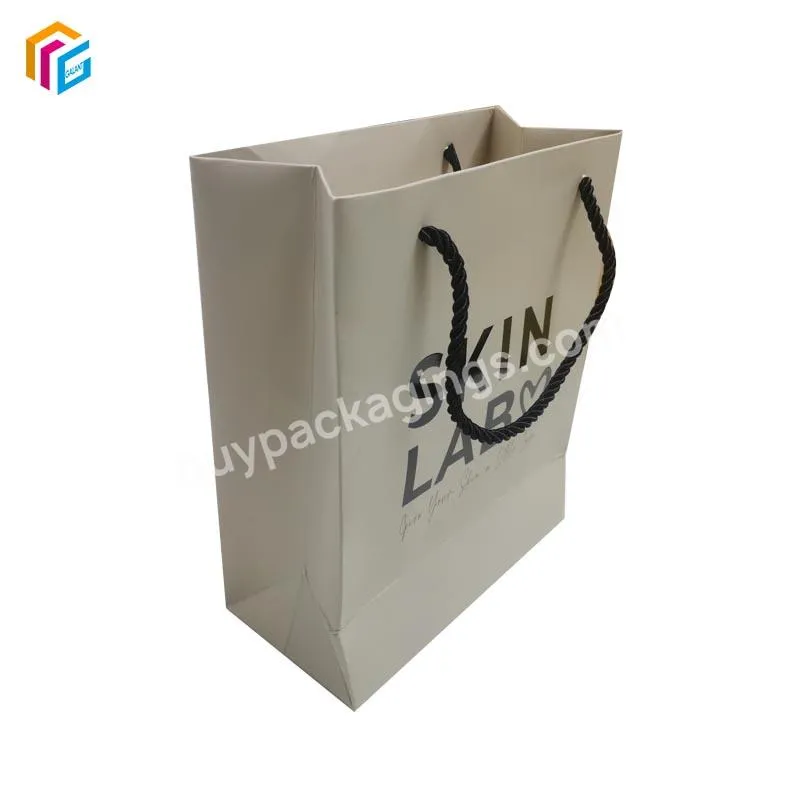 Custom Logo Printed Cardboard Bolsas Shopping Garment Retail Carry Luxury Packaging Gift Paper Bag With Ribbon Handle