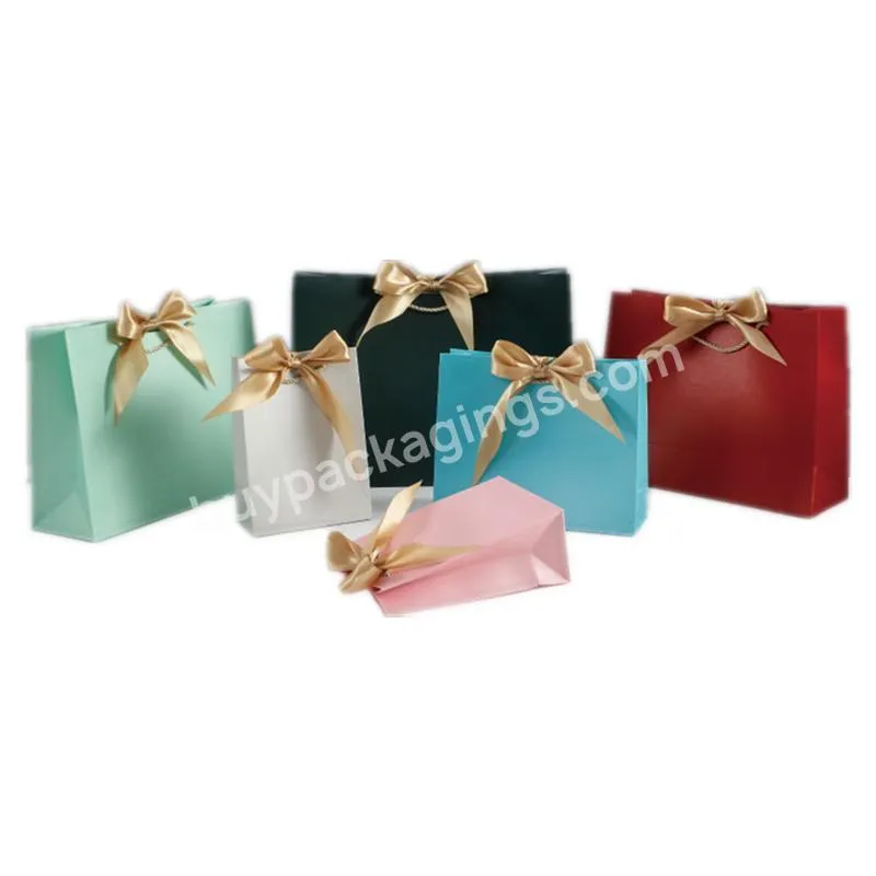 Factory wholesale cheap small paper bag customized color print stripe gift paper bag manufacturer with ribbon