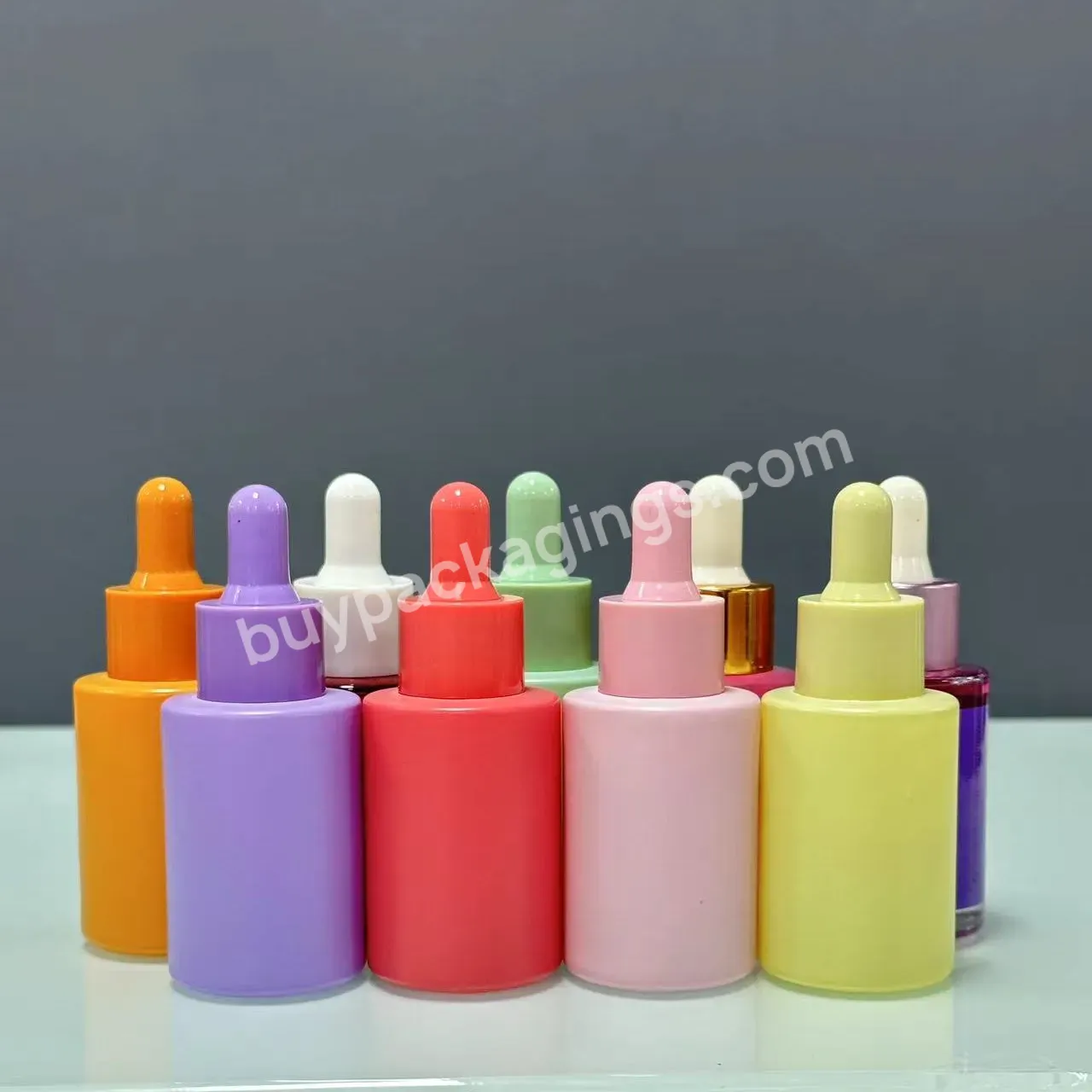 Hot Sell 10ml 20ml 30ml 50ml 60ml Customizable Pink Flat Shoulder Bottle Dropper Glass Skin Care Oil Glass Bottle With Lid