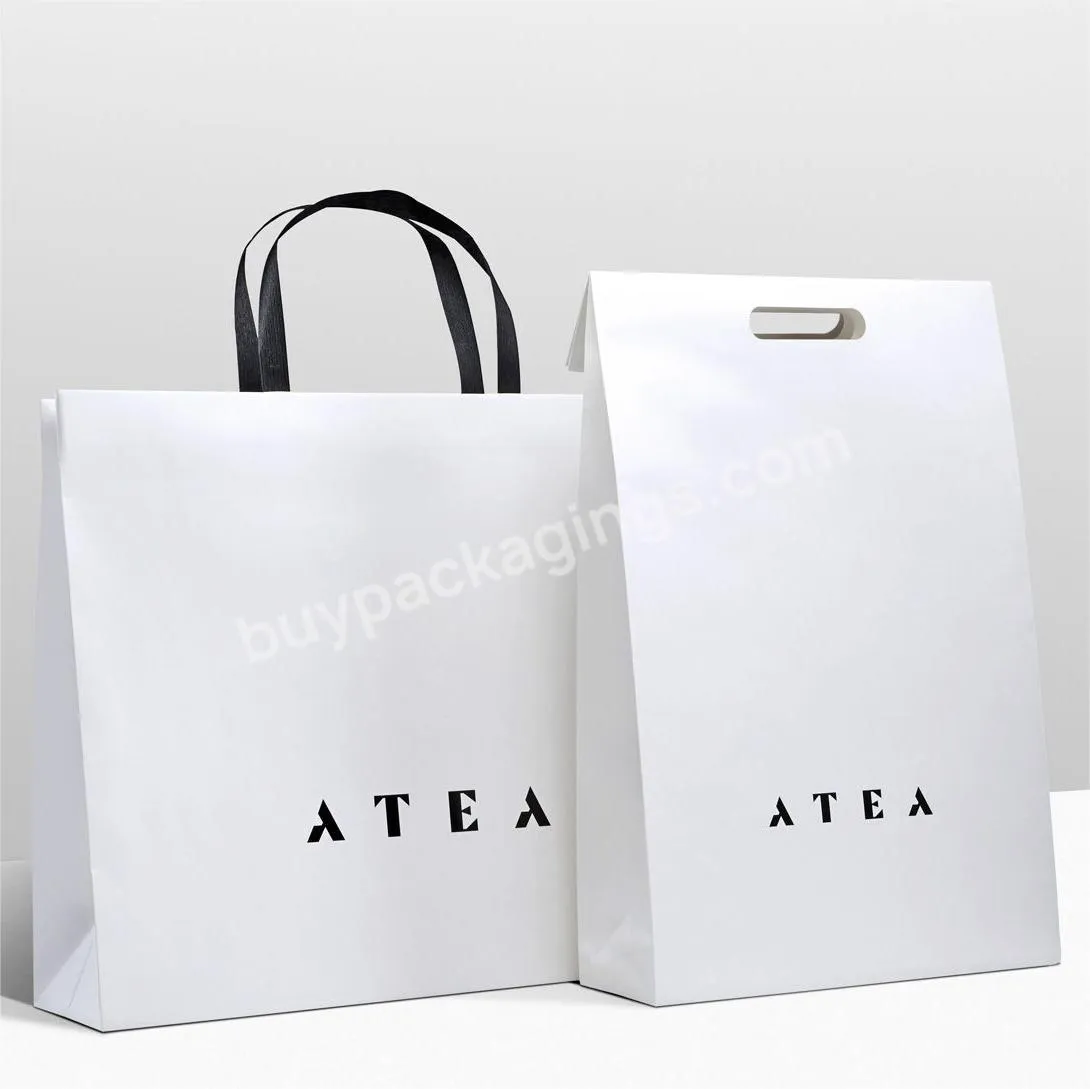 Luxury packing bag Custom logo gift bag glossy clothes branded retail shopping paper bags with rope handles