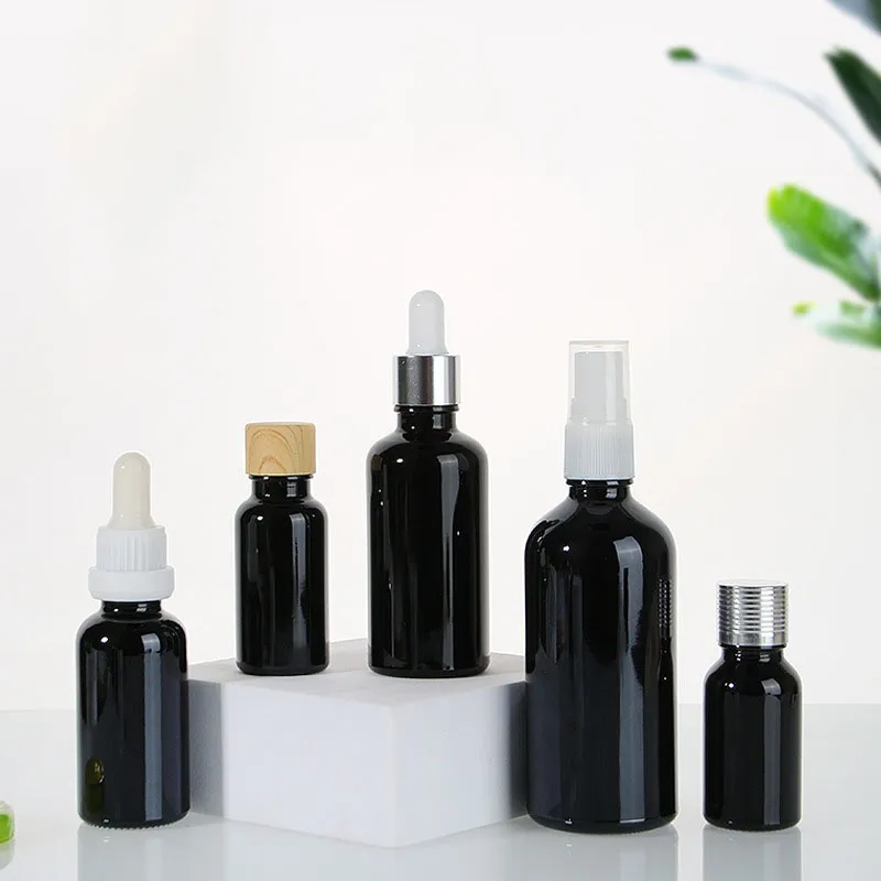 Multiple Capacity 10ml 30ml 50ml 100ml  Black Color Glass Material Essential Oil Bottle With Multiple Cover