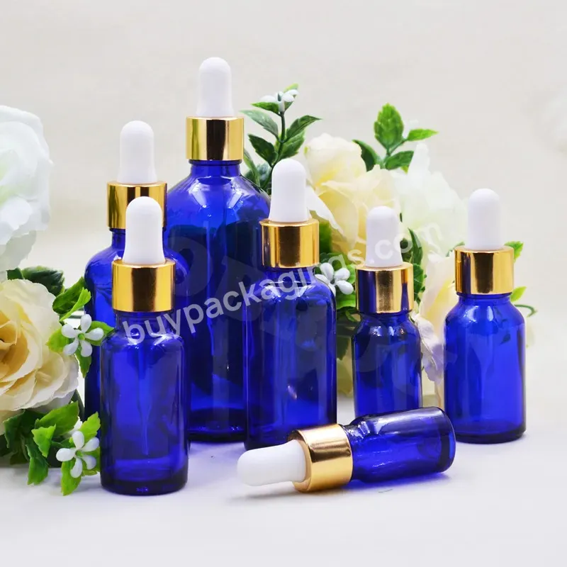 Obrou 5ml 10ml 15ml 20ml 30ml 50ml 100ml Wholesale Glass Cobalt Blue Essential Oil Bottle With Gold Collar