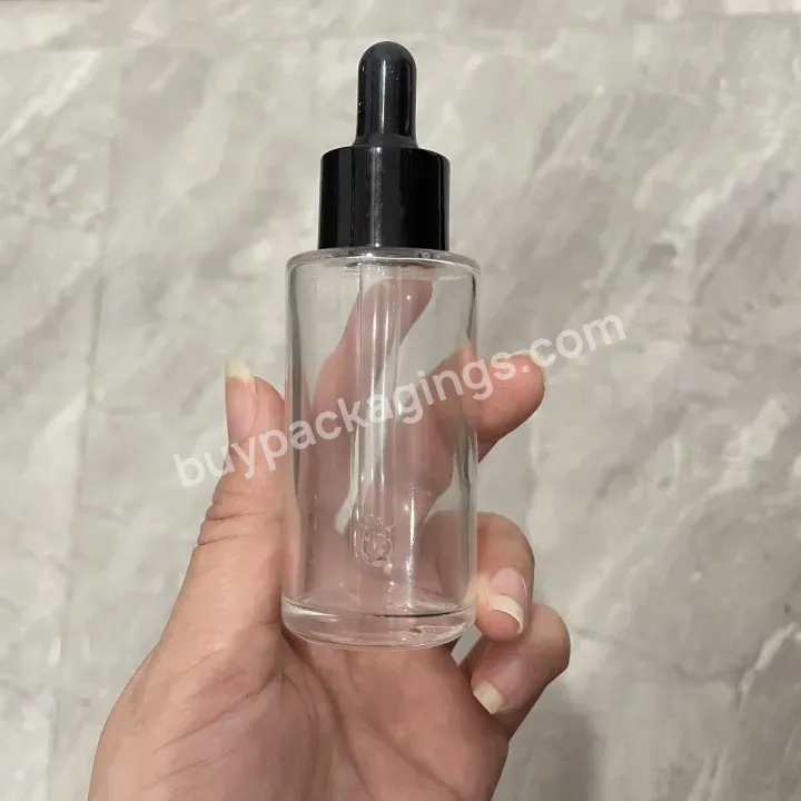 Obrou Factory Wholesale Essential Oil Flat Shoulder 30ml 50ml Transparent Cosmetic Glass Dropper Bottle With White Paper Box