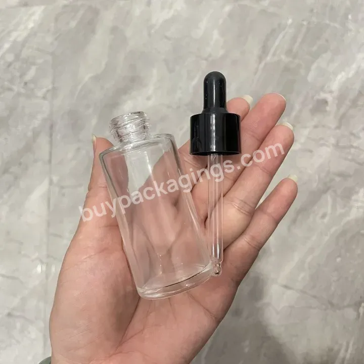 Obrou Factory Wholesale Essential Oil Flat Shoulder 30ml 50ml Transparent Cosmetic Glass Dropper Bottle With White Paper Box