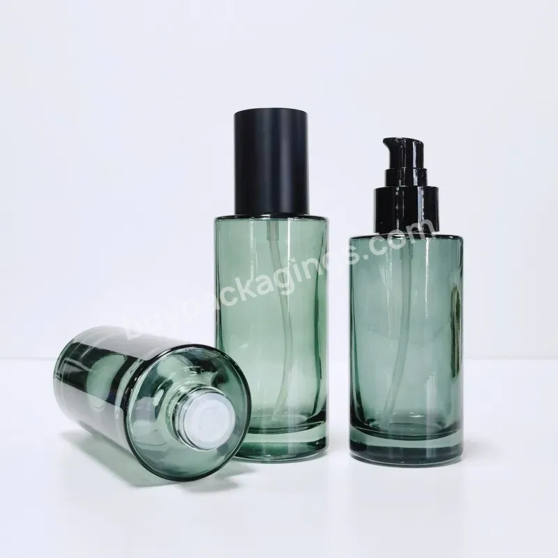 Unique Custom Cosmetic Glass Pump Bottle Green Color Cream Lotion Glass Bottle Set With Pump