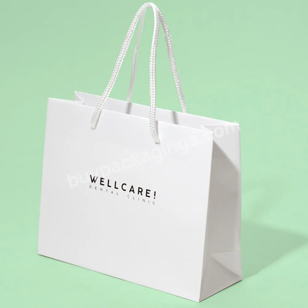 White Paper Shoes Cloth Packaging Gift Shopping Bag With Customized Logo For Apparel
