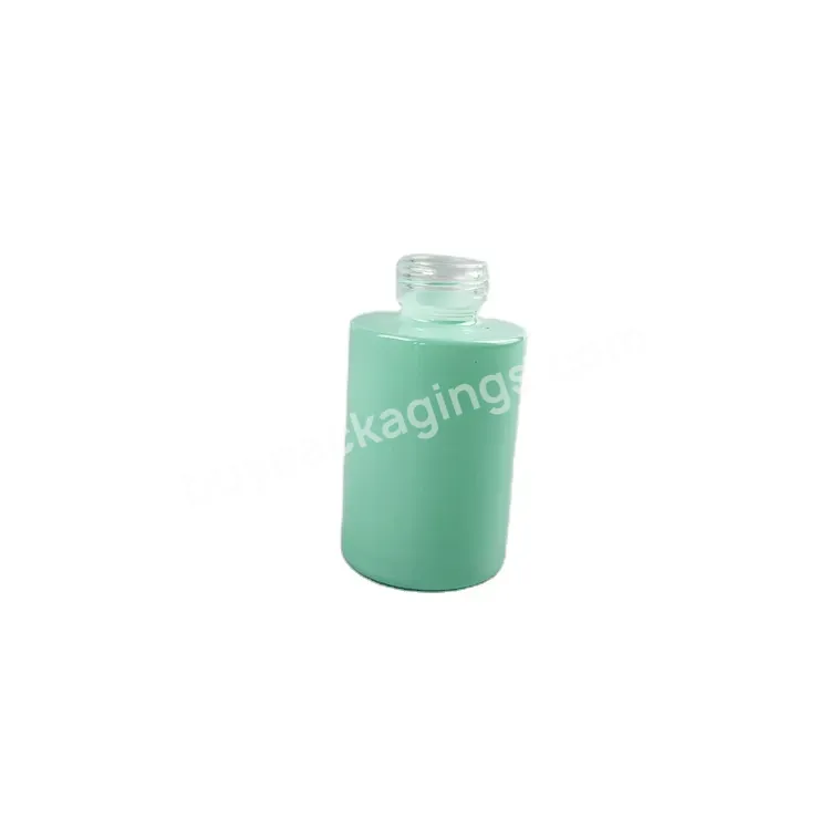 Wholesale 30ml Flat Shoulder Green Glass Bottle 1 Oz Round Glass Cosmetic Bottle With Cream Pump Top