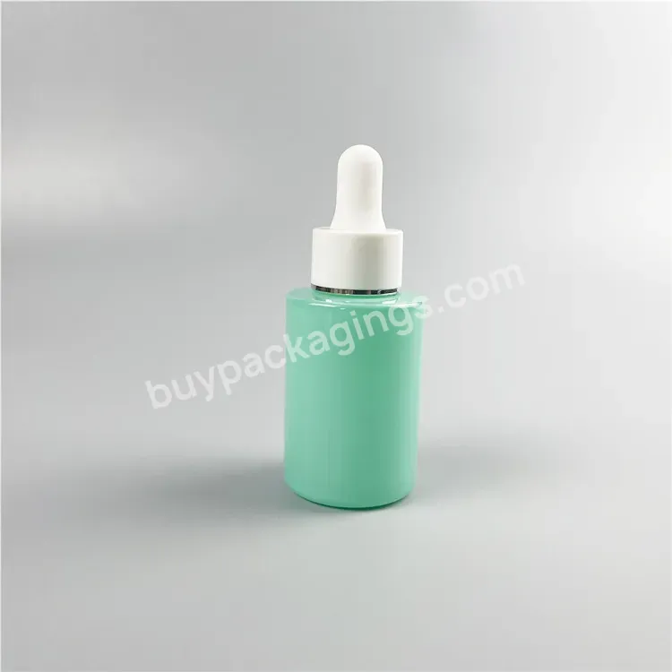 Wholesale 30ml Flat Shoulder Green Glass Bottle 1 Oz Round Glass Cosmetic Bottle With Cream Pump Top