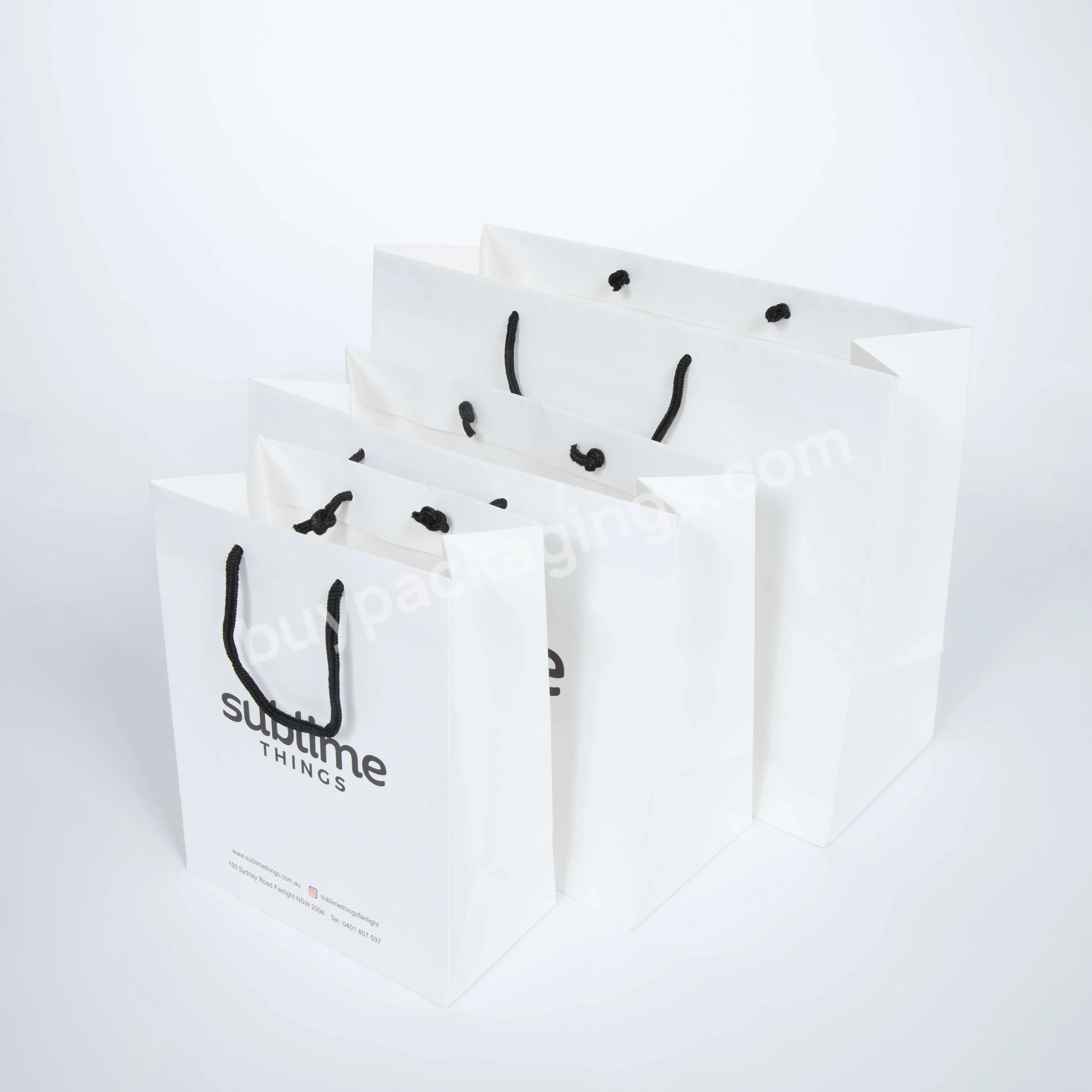 Wholesale Luxury Cheap Black Hot Stamping Logo Apparel Packaging Shopping Bag Paper Bag